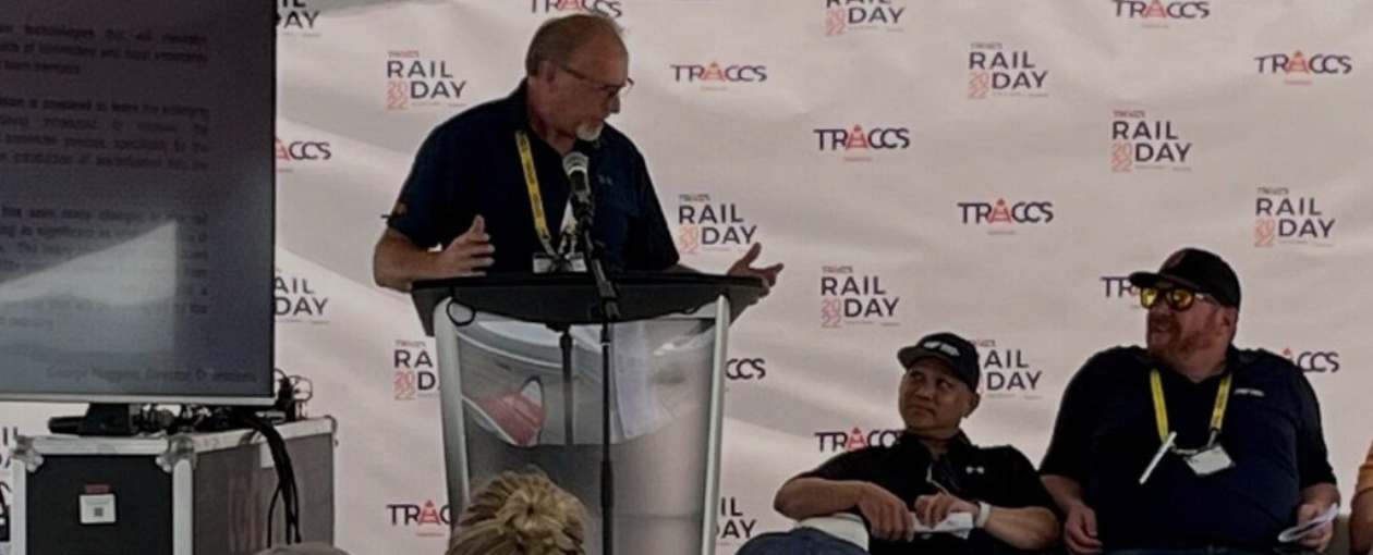 An image showing a TTR Employee at a podium speaking