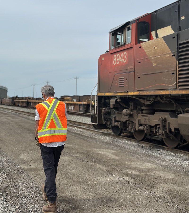 A TTR West employee shown with their back towards the viewer located in Deltraport BC