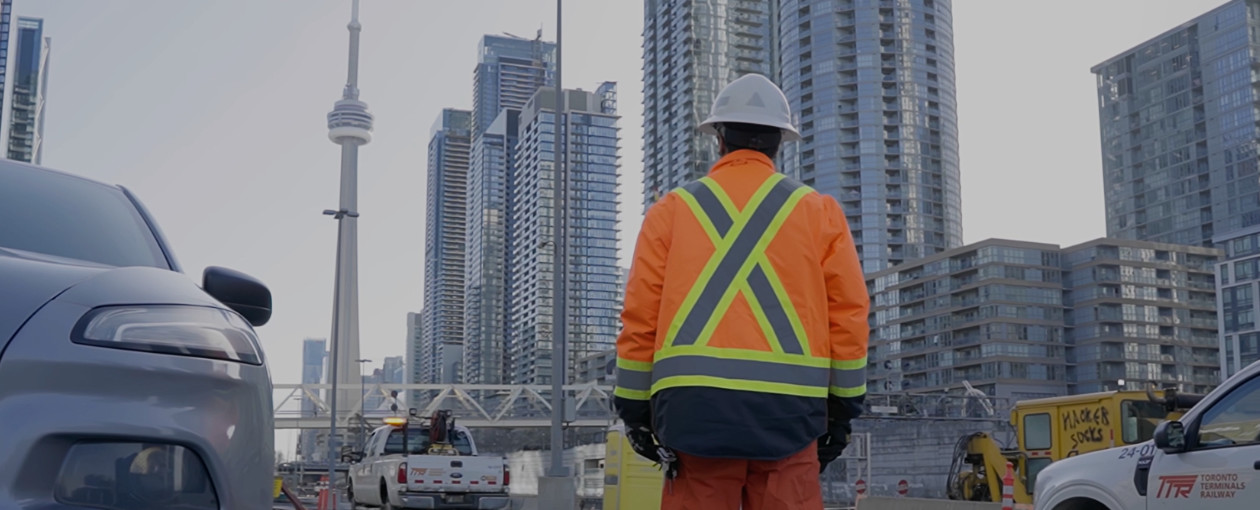 A TTR worker looking at the CN Tower
