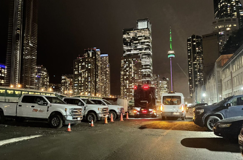 Image of trucks in a parking lot at night