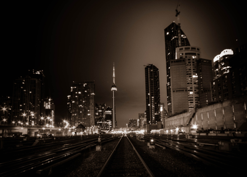 A Sepia image of Toronto skyline from the train tracks