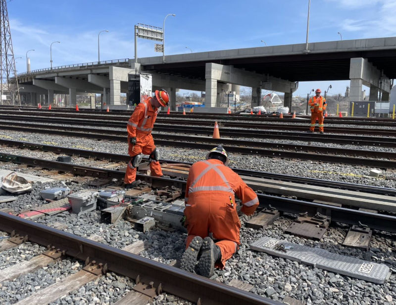 3 TTR workers working on train tracks