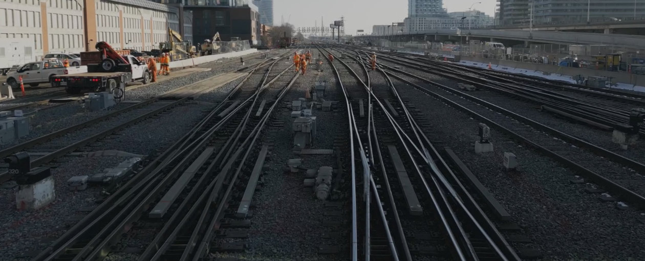 Multiple TTR workers on the railway tracks from a distance