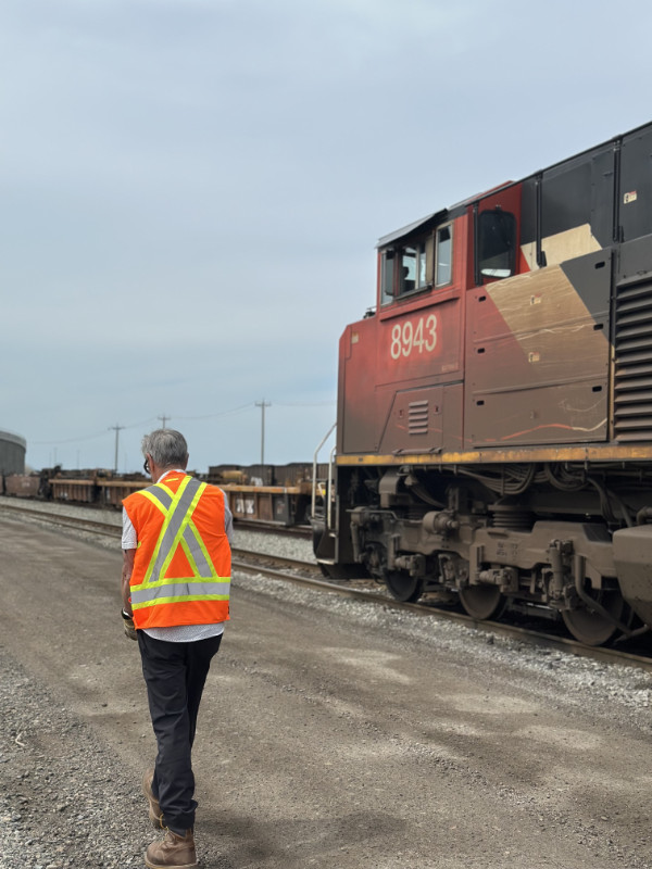 TTR worker walking along a train in Deltaport BC