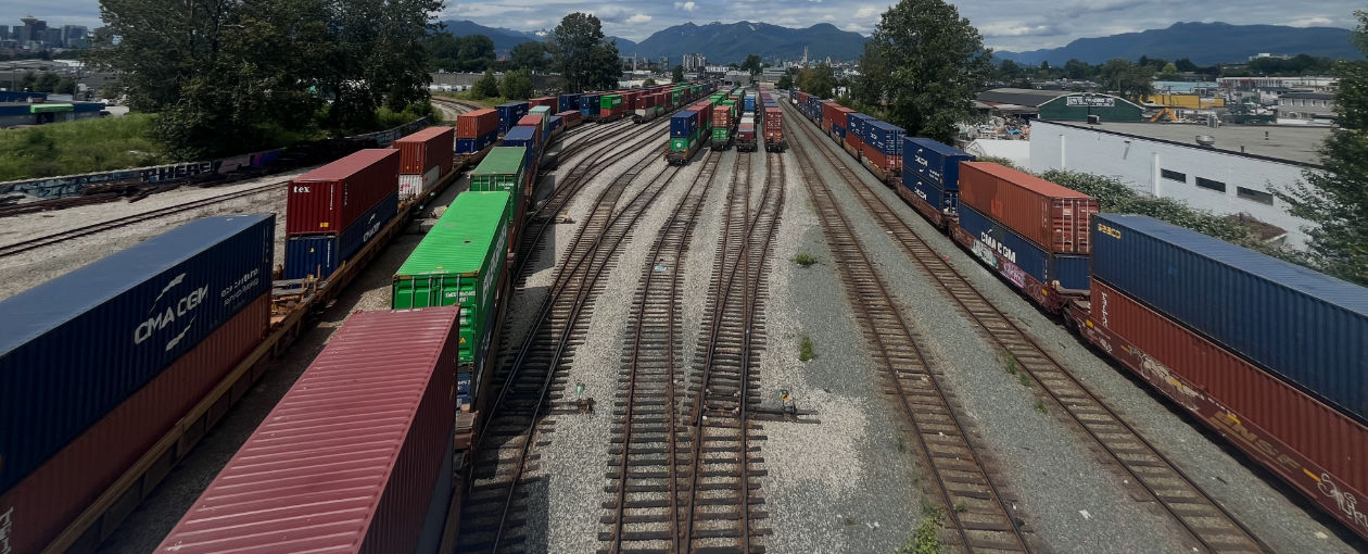 Lots of shipping containers on railway tracks in Deltaport BC