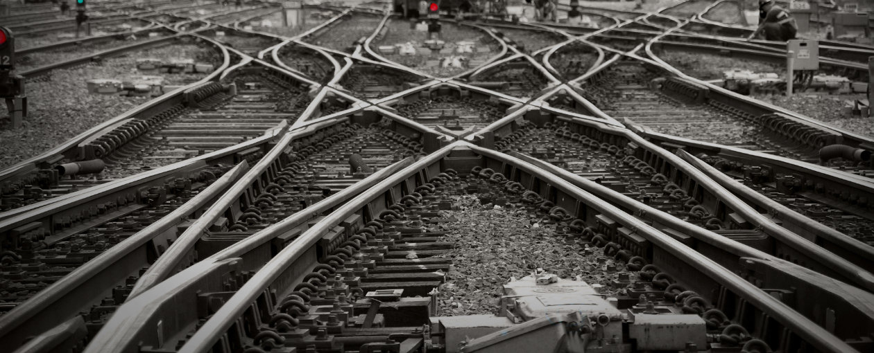 An image of crossing train tracks close up